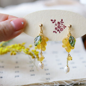 Yellow grape earrings presented in gift-ready packaging