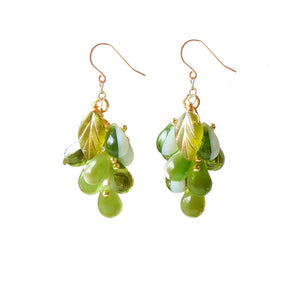 Side view of purple Czech glass grape cluster dangle earrings showing hand-wired bead detail