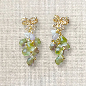 Handmade grape‑inspired earrings with gold bow, green and purple translucent beads and pearl accents, elegant Western‑style jewelry for women in the US and Europe