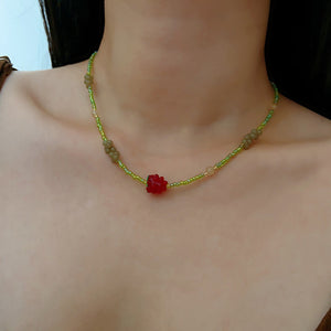 Cherry beaded necklace, side view with beaded detail