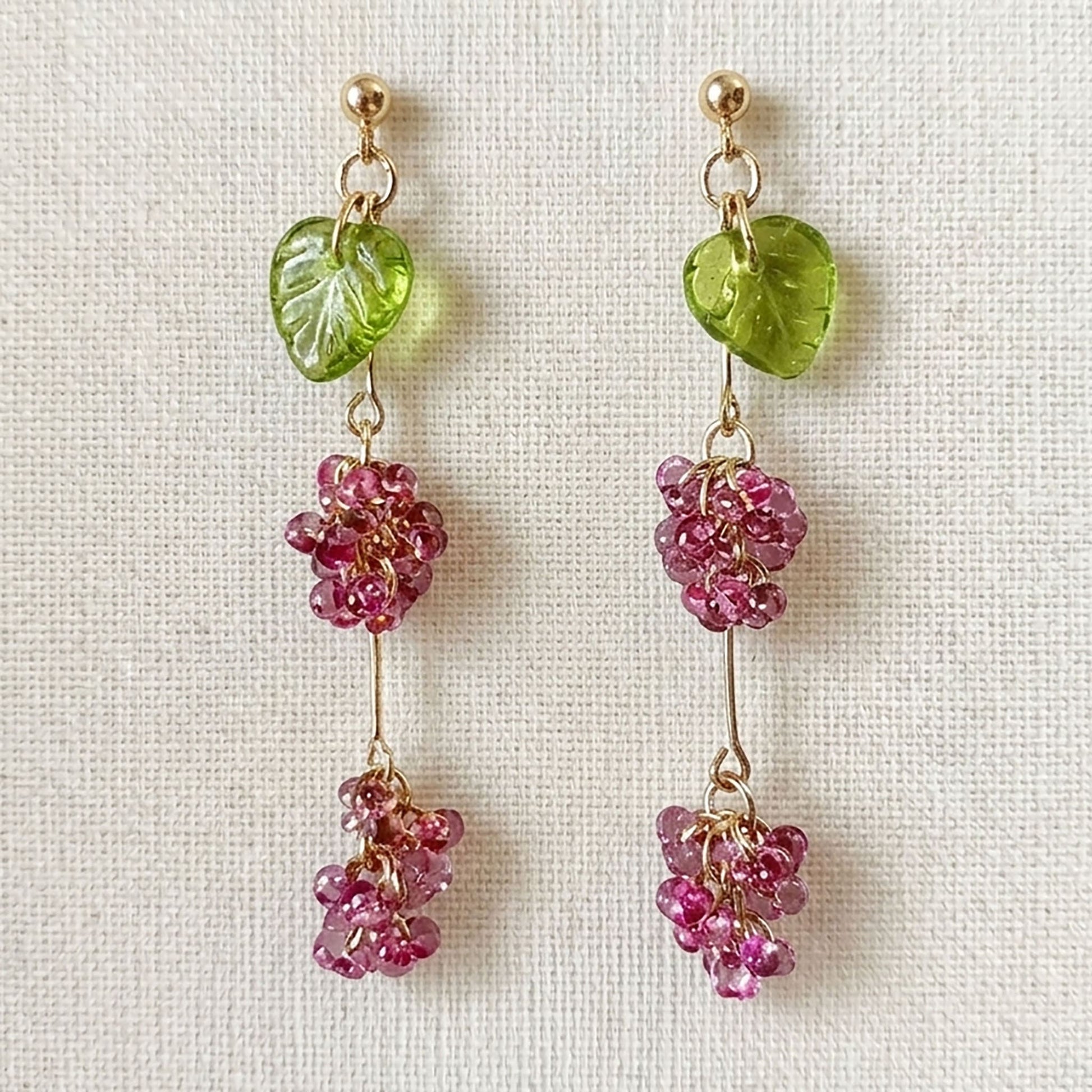 Close-up of Bohemian glass bead earrings showing the fire-polished elderberry texture