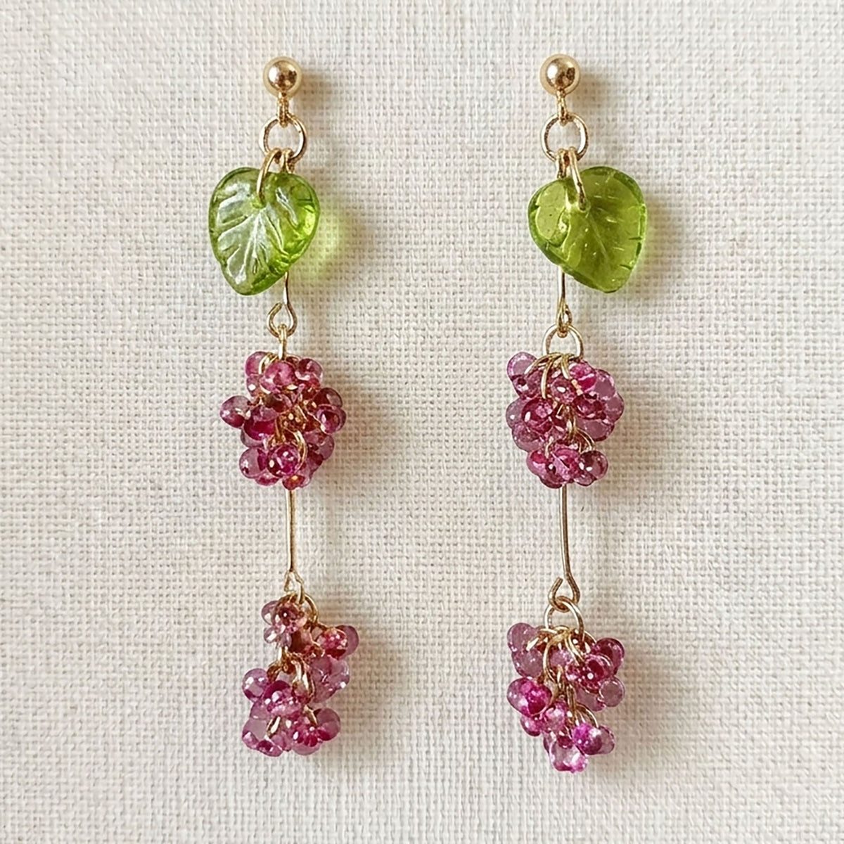 Close-up of Bohemian glass bead earrings showing the fire-polished elderberry texture