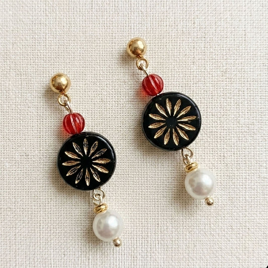 Close-up of Gold Filled Pearl Earrings featuring pink Czech glass flowers and lustrous white pearls on handmade gold wire. Lifestyle view of floral dangles being worn against a linen background. Side profile of vintage style glass flower earrings highlighting the 14k gold-filled ear wire