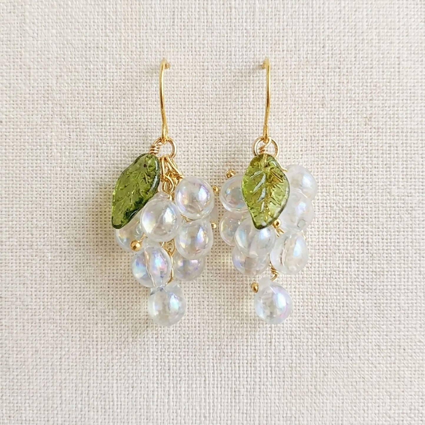 Detailed view of the artisan wire-wrapping on the botanical fruit jewelry