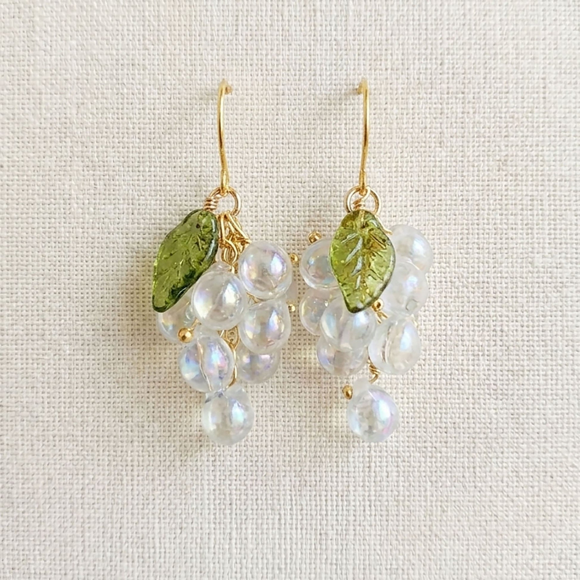 Detailed view of the artisan wire-wrapping on the botanical fruit jewelry