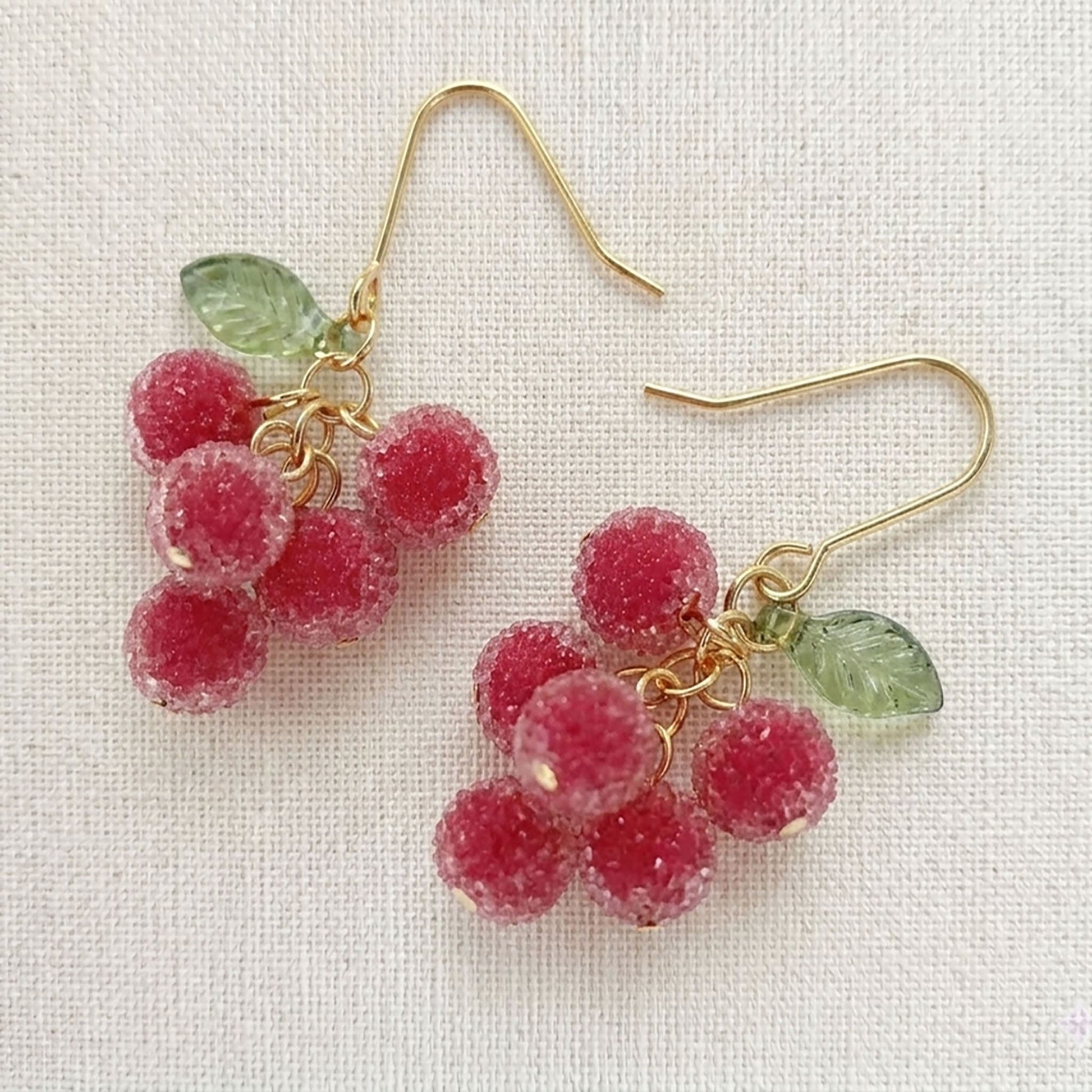 Detailed view of the silver-plated wire construction on handmade fruit cluster earrings