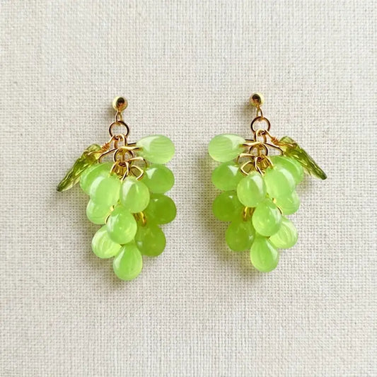 Handmade Czech glass earrings with light green translucent grape beads and gold detailing, nature‑inspired bohemian jewelry for women