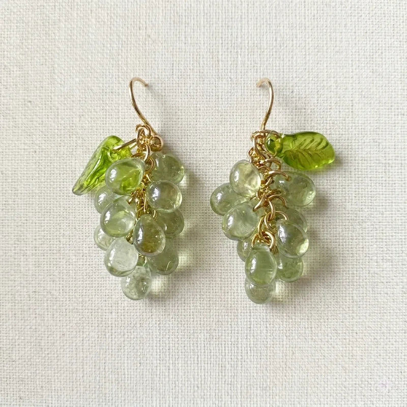 Handmade Czech glass earrings with light green translucent grape beads and green leaf accents, nature‑inspired bohemian jewelry for women