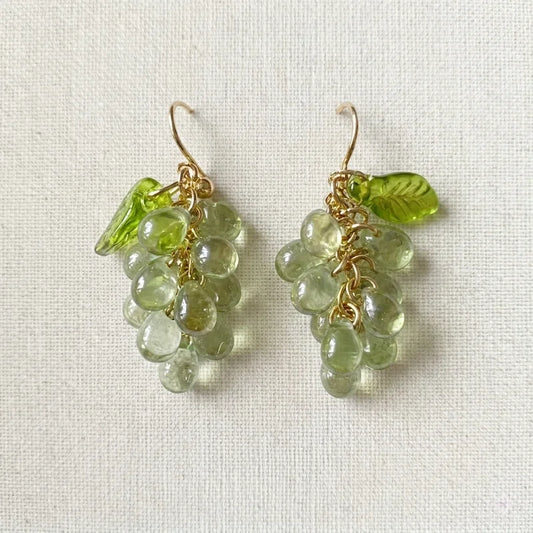 Handmade Czech glass earrings with light green translucent grape beads and green leaf accents, nature‑inspired bohemian jewelry for women