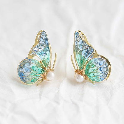 Handmade butterfly earrings with blue‑green gradient wings, gold detailing and pearl accent, elegant Western‑style jewelry for women in the US and Europe