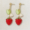 Handmade fruit-inspired earrings with red raspberry charm, green leaf bead and white flower detail, elegant Western-style jewelry for women in the US and Europe