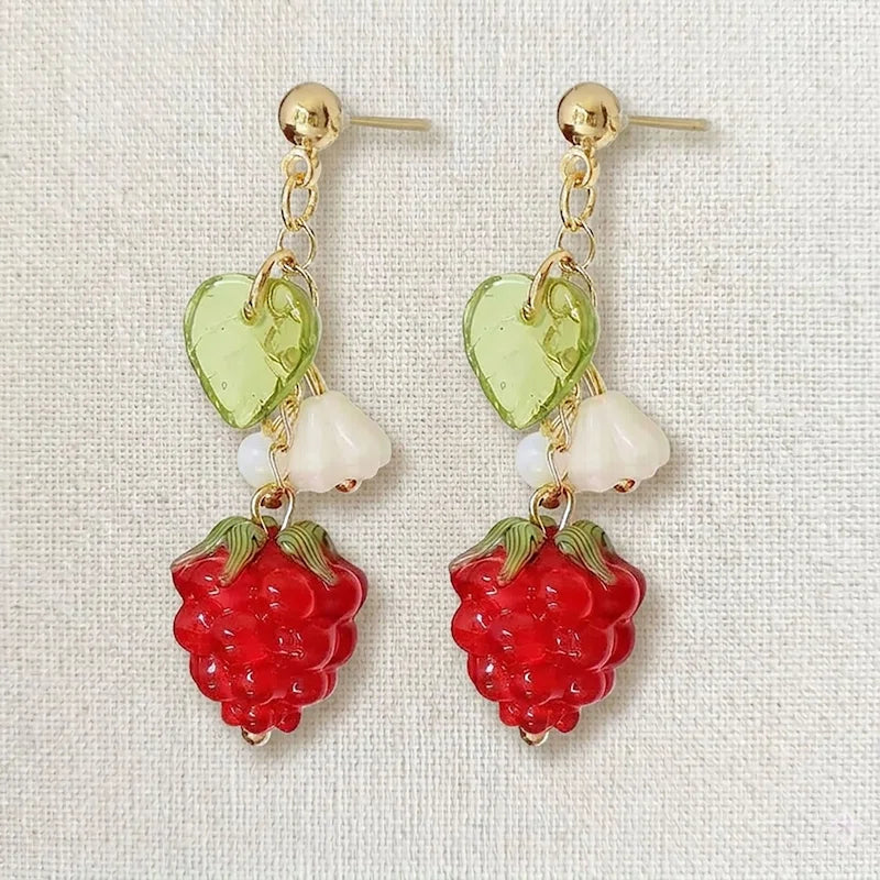 Handmade fruit-inspired earrings with red raspberry charm, green leaf bead and white flower detail, elegant Western-style jewelry for women in the US and Europe