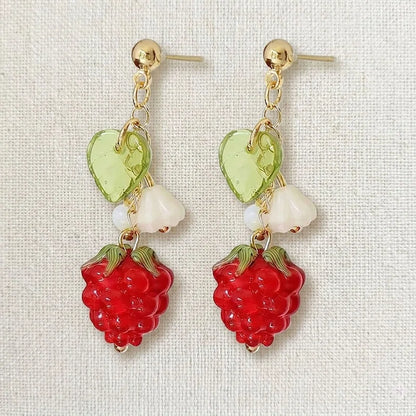 Handmade fruit-inspired earrings with red raspberry charm, green leaf bead and white flower detail, elegant Western-style jewelry for women in the US and Europe