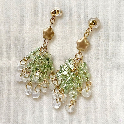 Pair of handmade Czech glass Christmas tree earrings featuring tiered green beads and a gold star topper