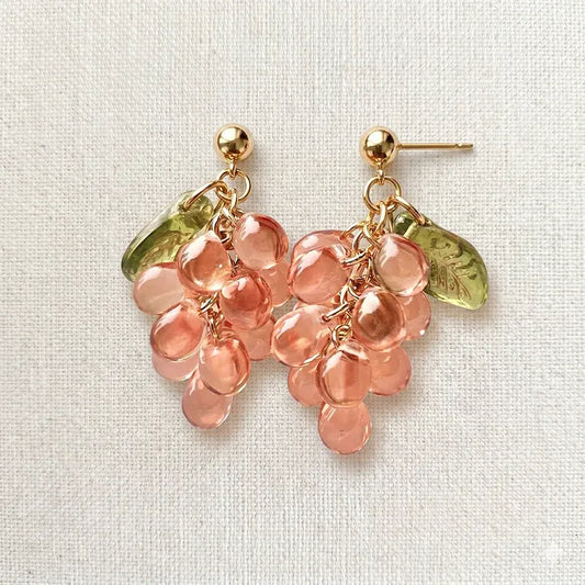 Handmade Czech glass earrings with translucent pink grape beads and green leaf accents, nature-inspired bohemian jewelry for women